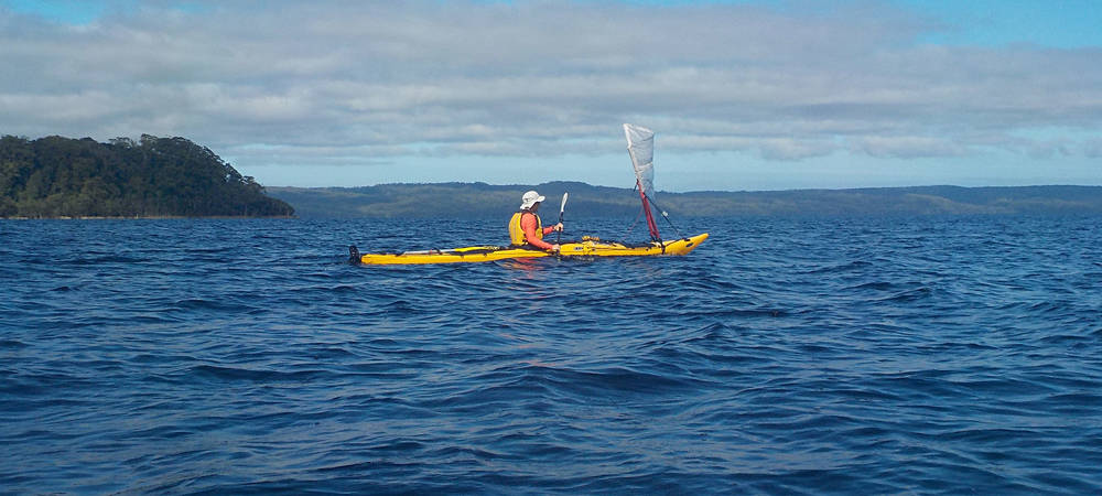 Kayak sailing in Macquarie Harbour